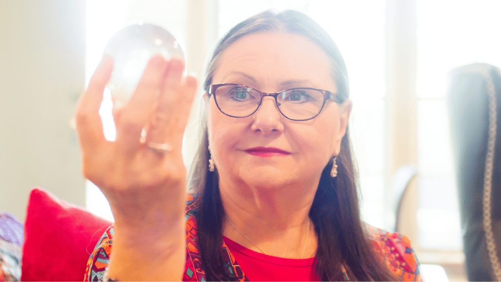 Patricia LaDale Lane holding a crystal ball